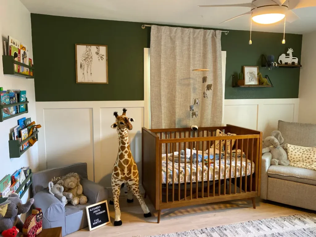Custom nursery with modern crib, built-in wall detailing, and playful children’s decor