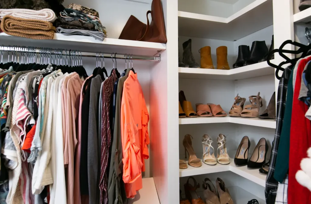 Custom walk-in closet with built-in shelving, hanging storage, and organized shoe display